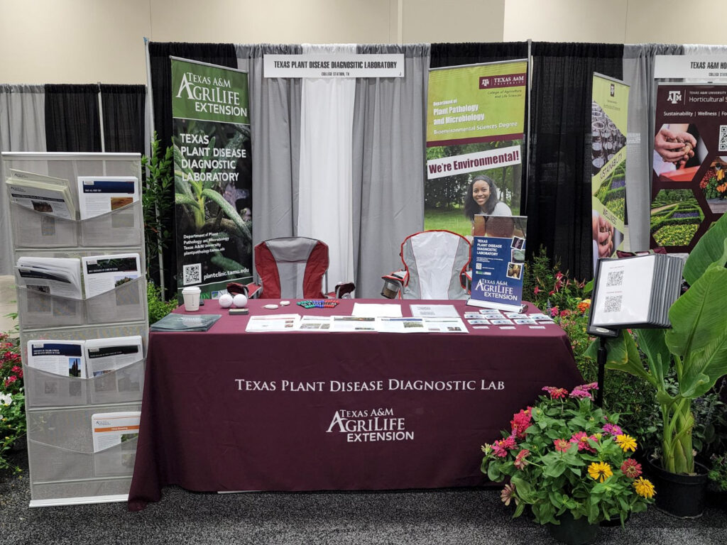 A table set up with Texas Plant Disease Diagnostic Lab information.